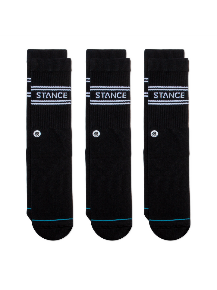 Three pairs of black socks with white "STANCE" logos and embroidered circular icon