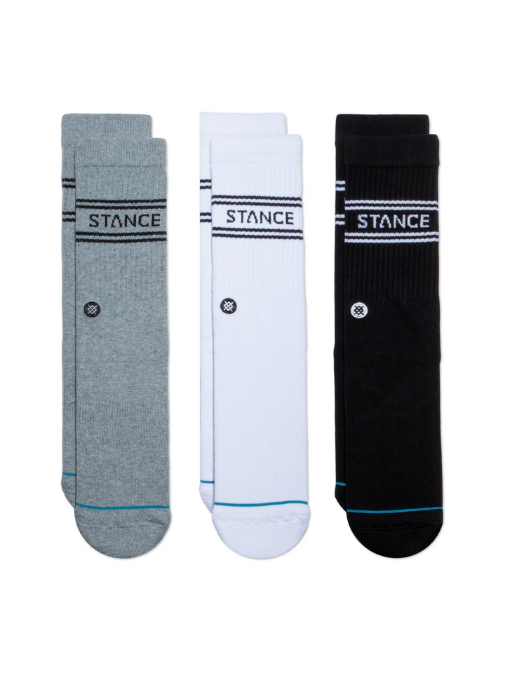 Three pairs of socks in grey, white and black, with "STANCE" logos and embroidered circular icon