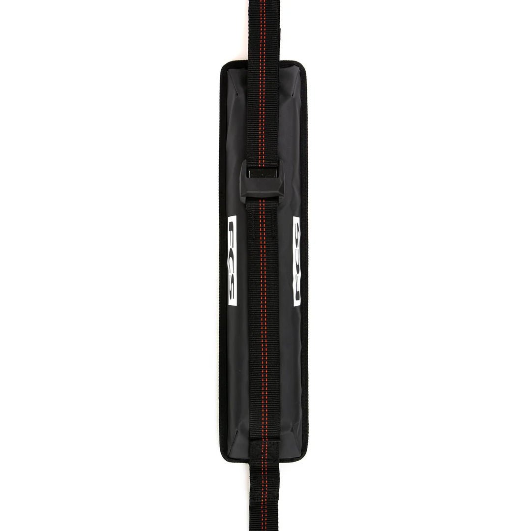 Black FCS roof strap with red accents on a white background