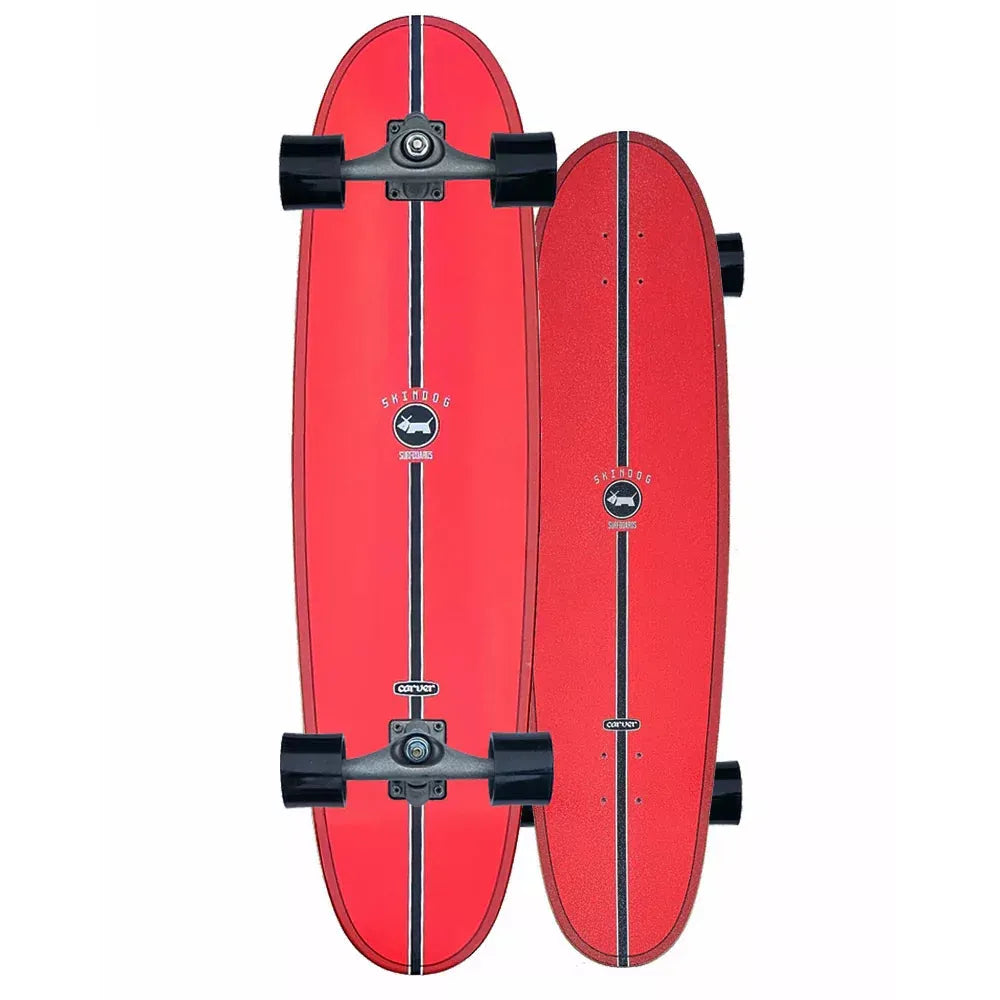Red skateboard with black trucks and bearings on a white background