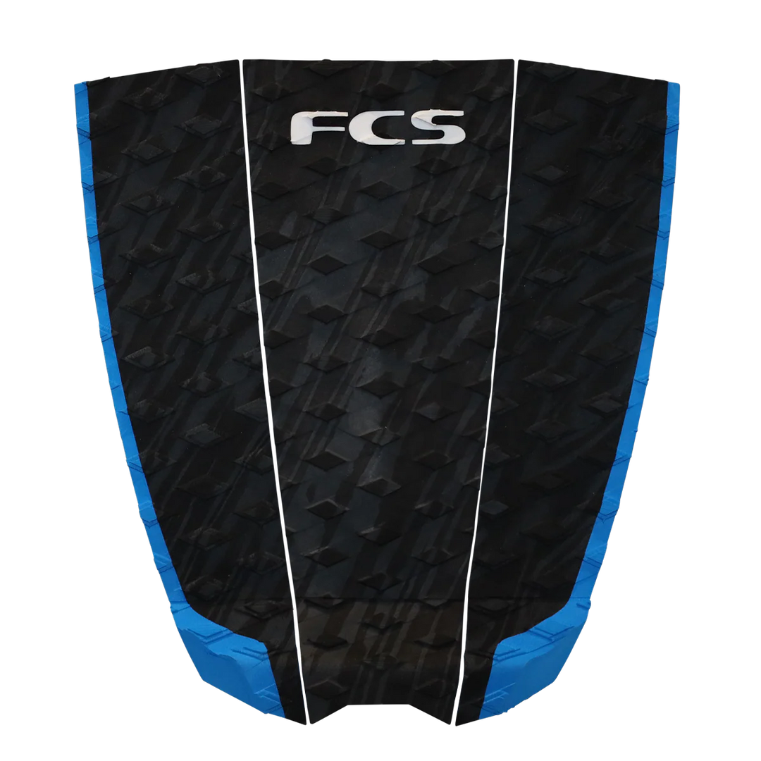 Black and blue FCS surfboard tail pad on a transparent background