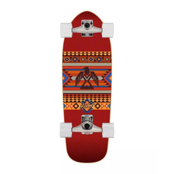 Skateboard with a red deck featuring an tribal pattern on a white background