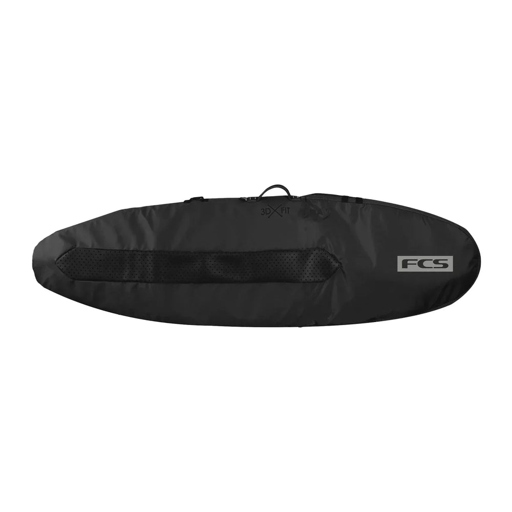 Black FCS surfboard bag on a white background