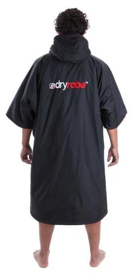 Person wearing a black dryrobe with visible branding on a white background