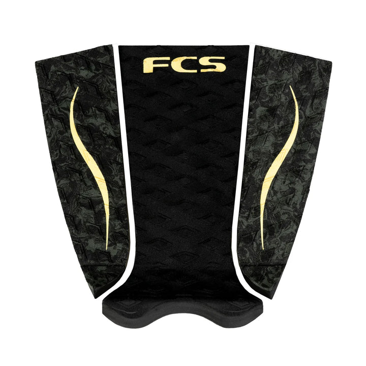 Black and gold FCS surfboard tailpad on a white background