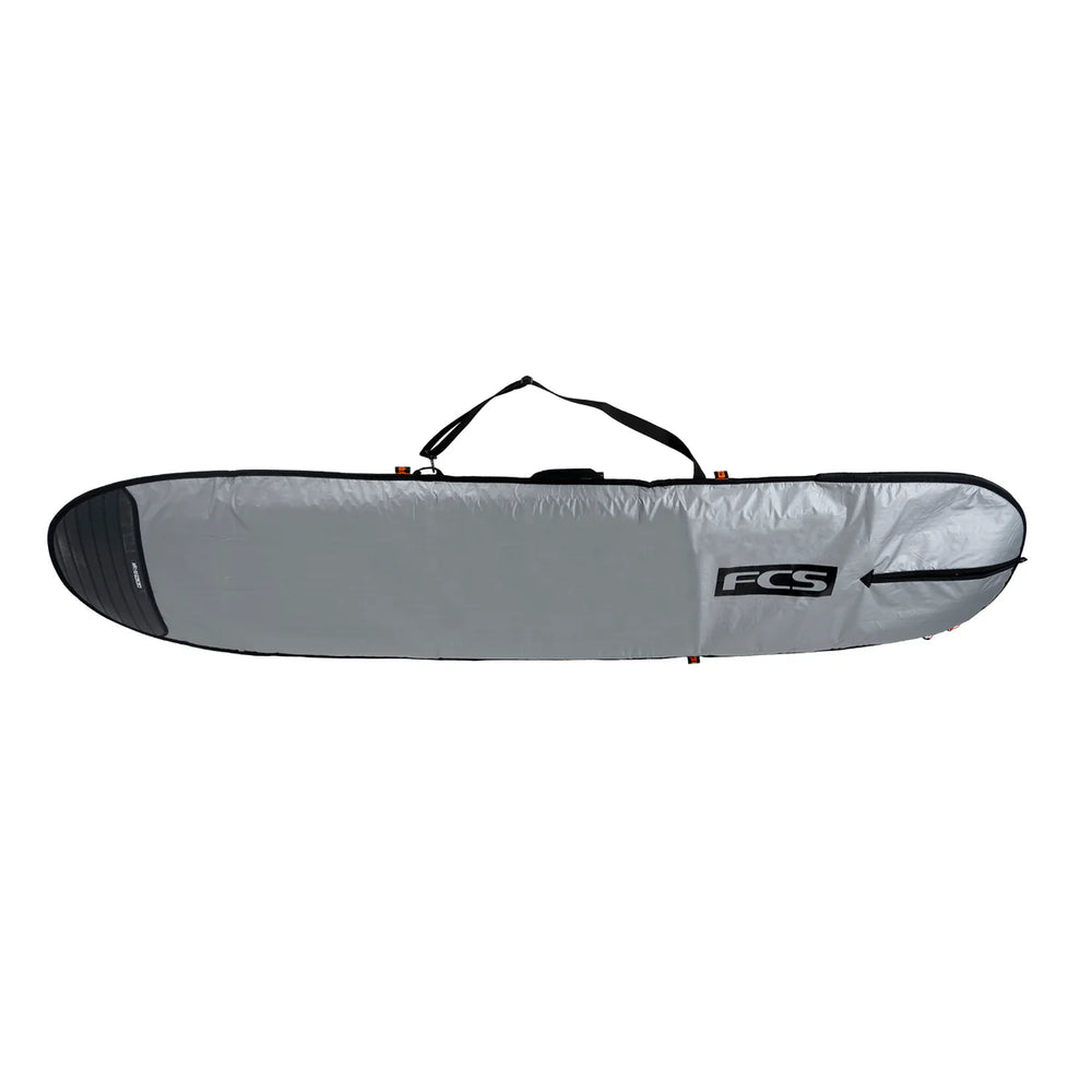 Silver surfboard bag with black FCS logo on a white background