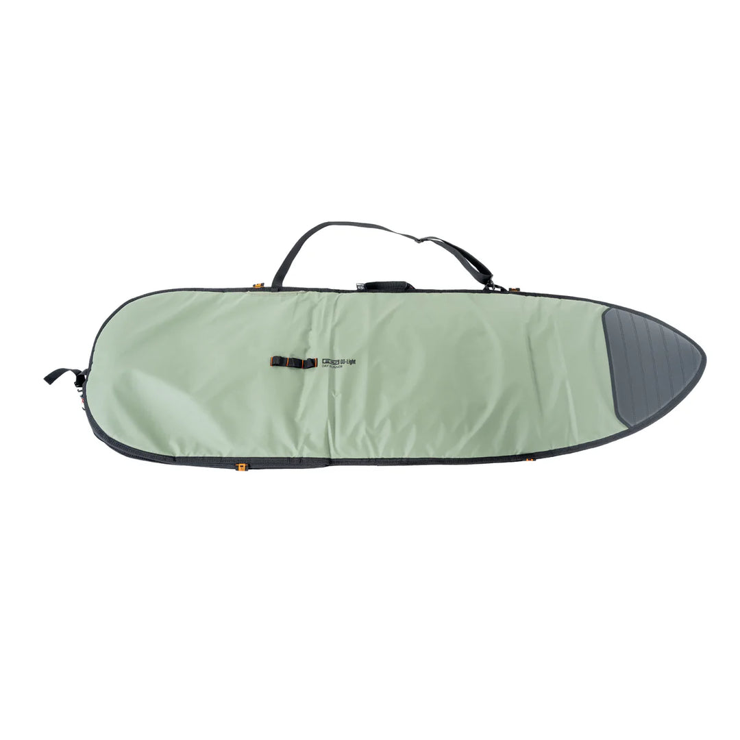Green and black FCS surfboard bag on a white background