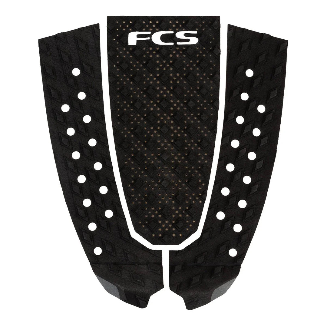 Black FCS surfboard tail pad on a white background