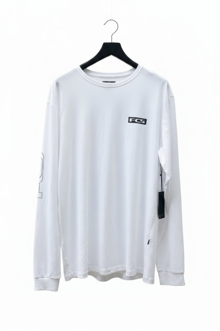 White long-sleeve shirt with a black FCS logo on a hanger against a white background. 