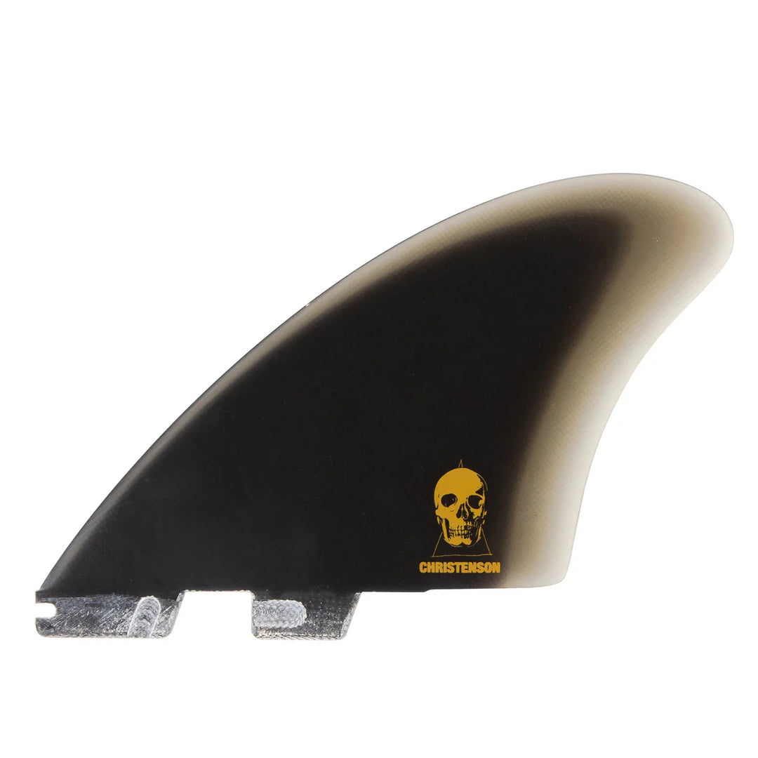 Surfboard fin with a skull design and 'Christenson' branding on a white background