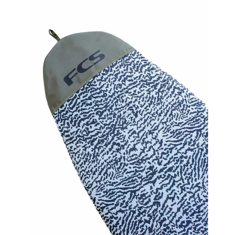 FCS branded surfboard cover with blue and grey pattern on a white background