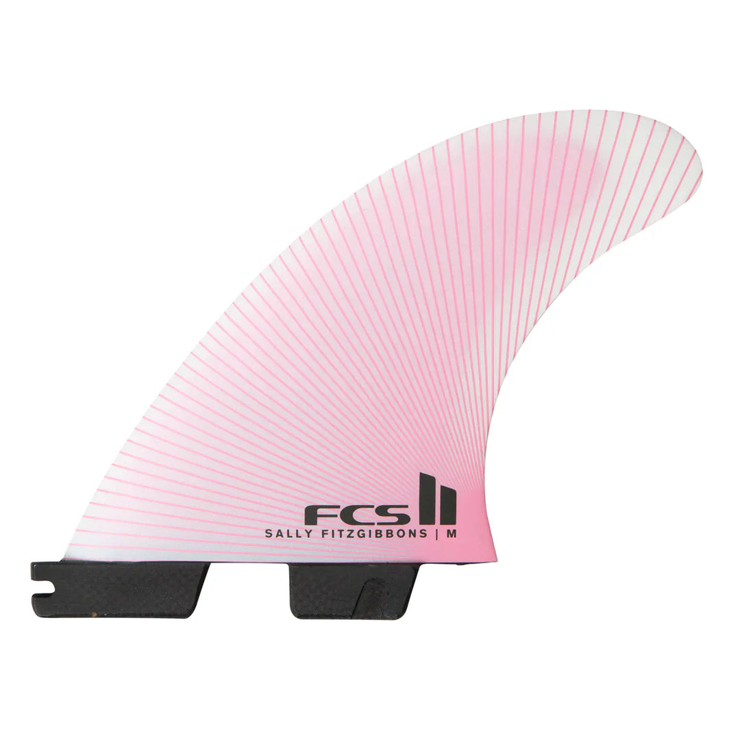 Pink surf fin with black base and 'FCS' branding on a white background
