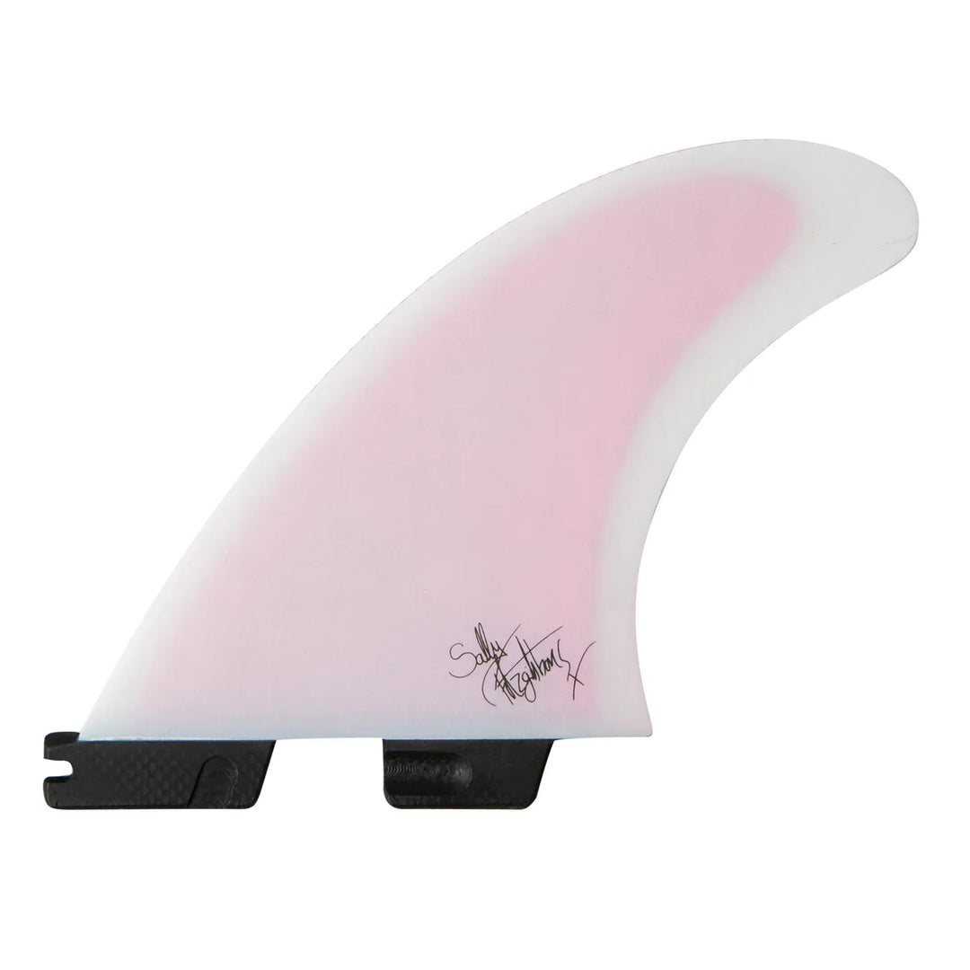 Pink and white surfboard fin with a signature on a white background