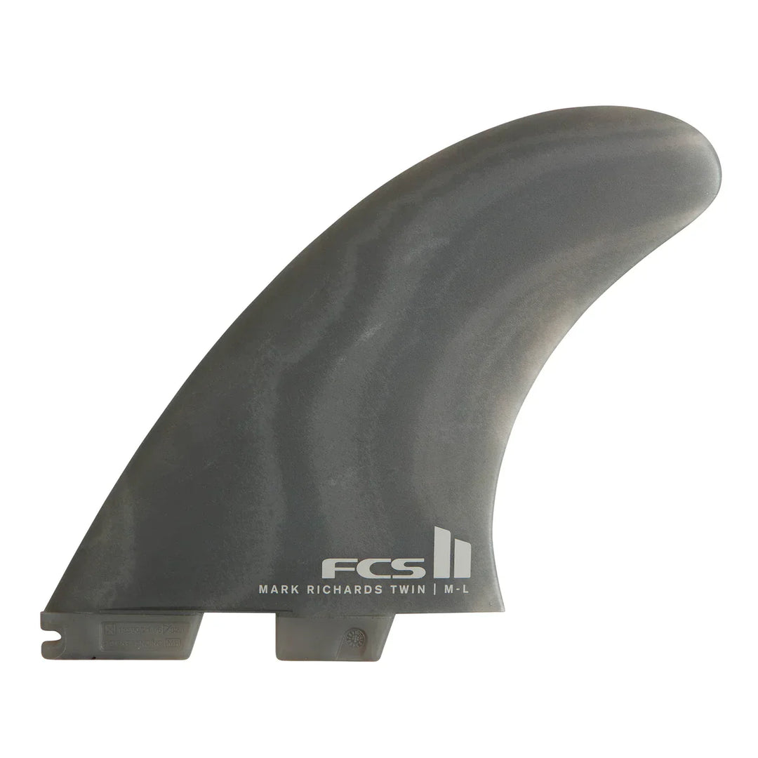 Grey surf fin with FCS logo on a white background