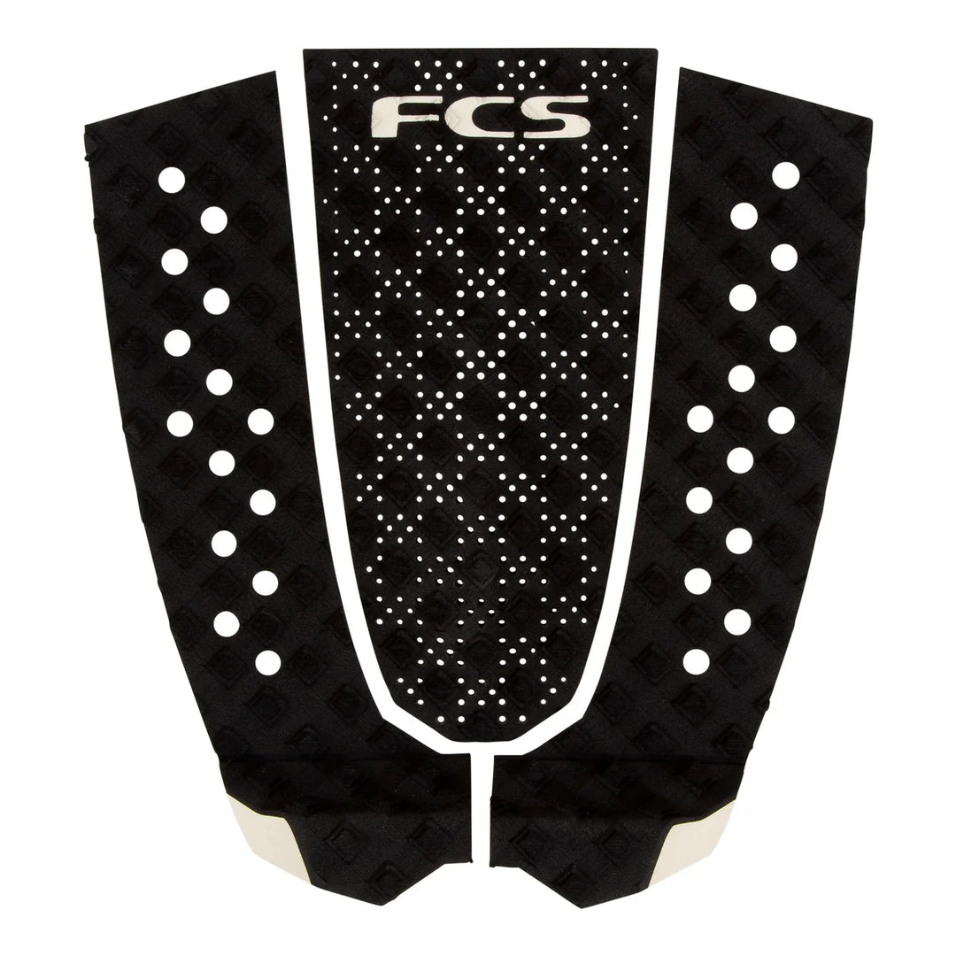 Black FCS surfboard tail pad on a white background.