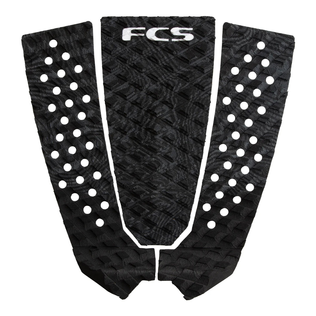 Black surfboard tail pad with grey patterns and 'FCS' branding on a white background