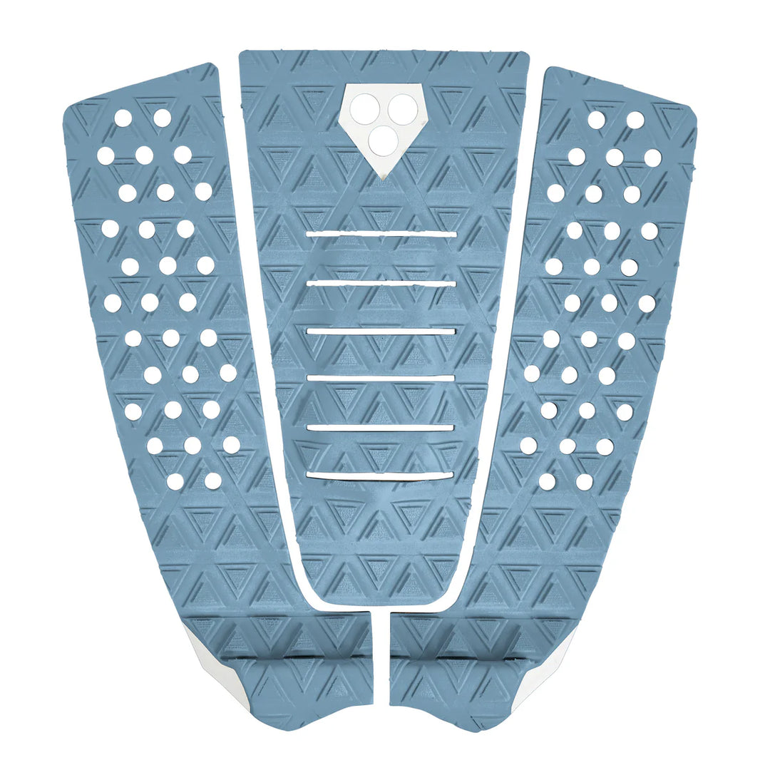 Blue surfboard tail pad with geometric patterns on a white background