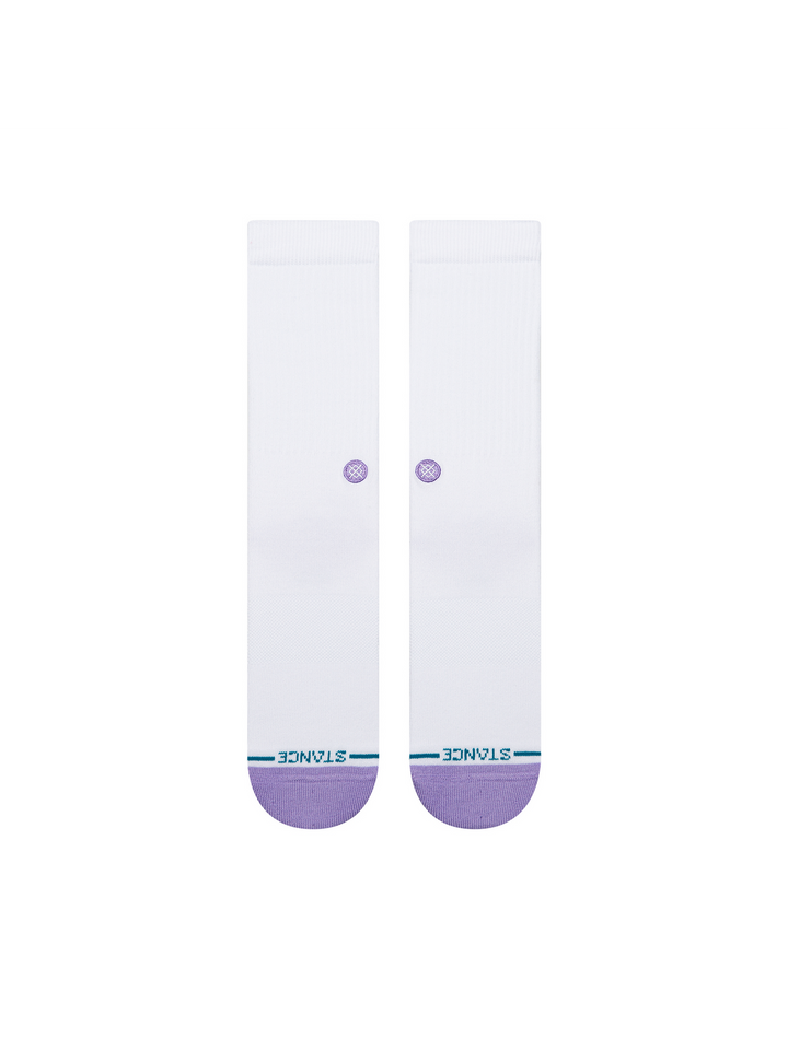 A pair of white crew socks with a light purple toe cap and a small purple circular detail on the upper calf, featuring the brand name &