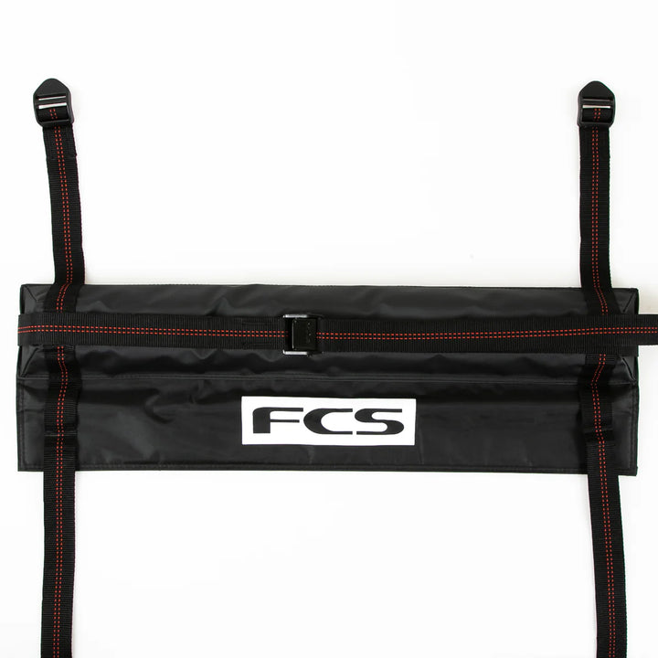 Black strap holder with FCS logo on a white background