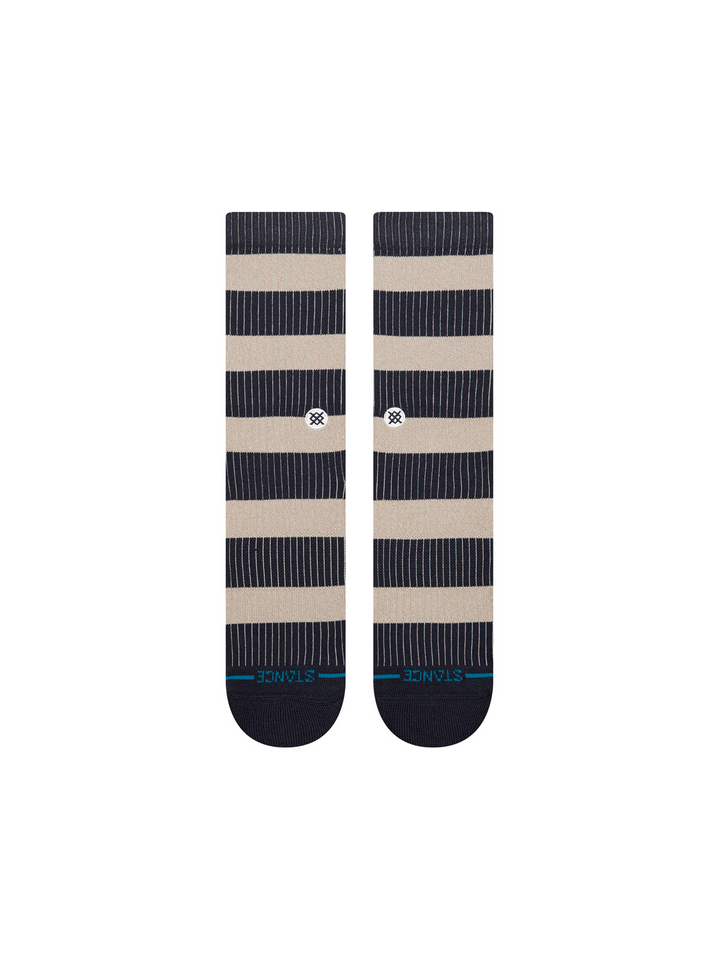 Striped pair of navy and beige crew socks with a blue stripe and STANCE logo across the toes, on a white background.