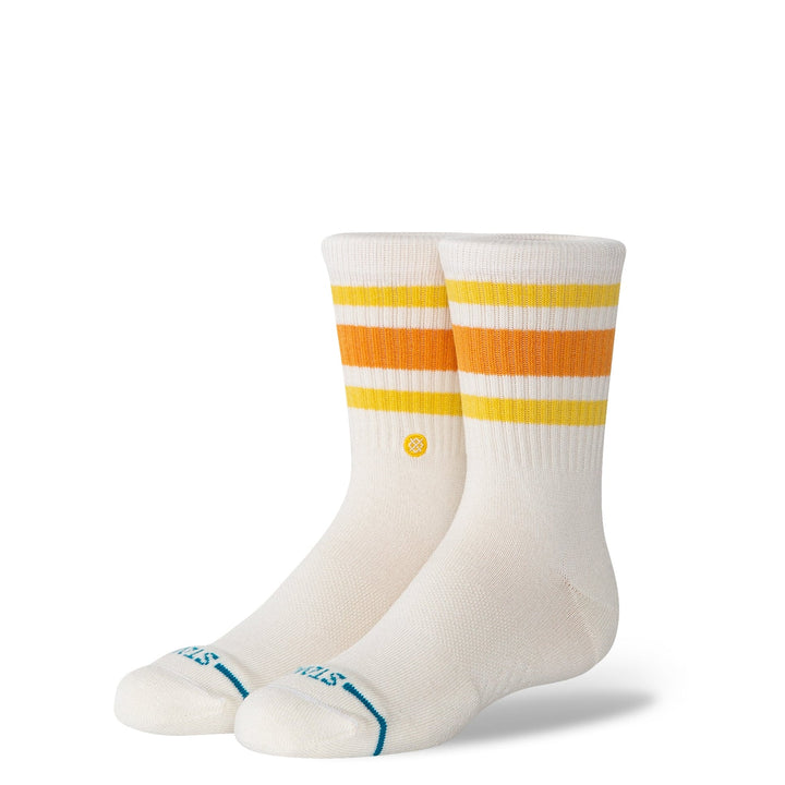 Kids crew sock in an off-white, with mustard and orange banded stripes near the top, and a STANCE branded blue seam across the toes
