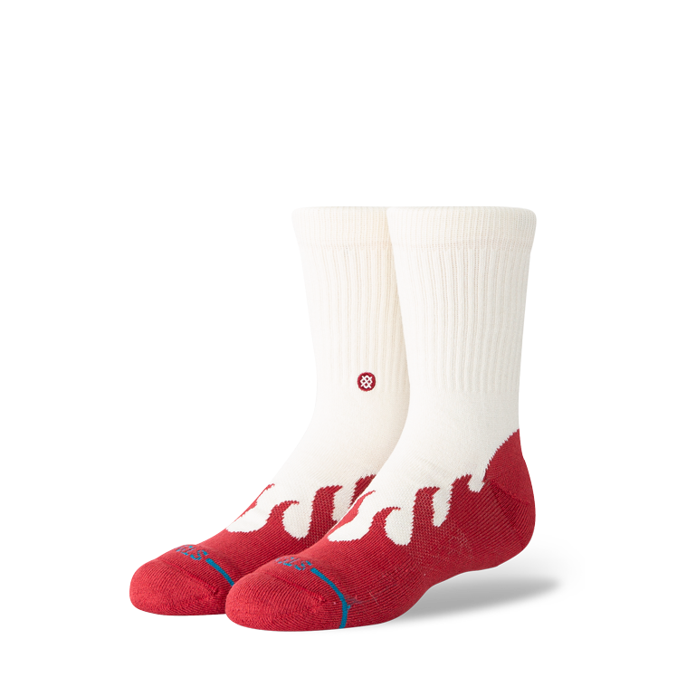 A pair of Stance crew socks in off-white and red, featuring a wavy red pattern on the lower half and a small red circular logo on the side, set against a plain white background.