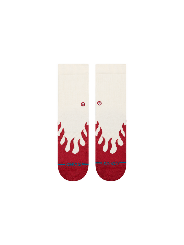 A pair of STANCE ankle socks with a cream upper and a red flame pattern at the toe, featuring a blue STANCE logo on the TOES.