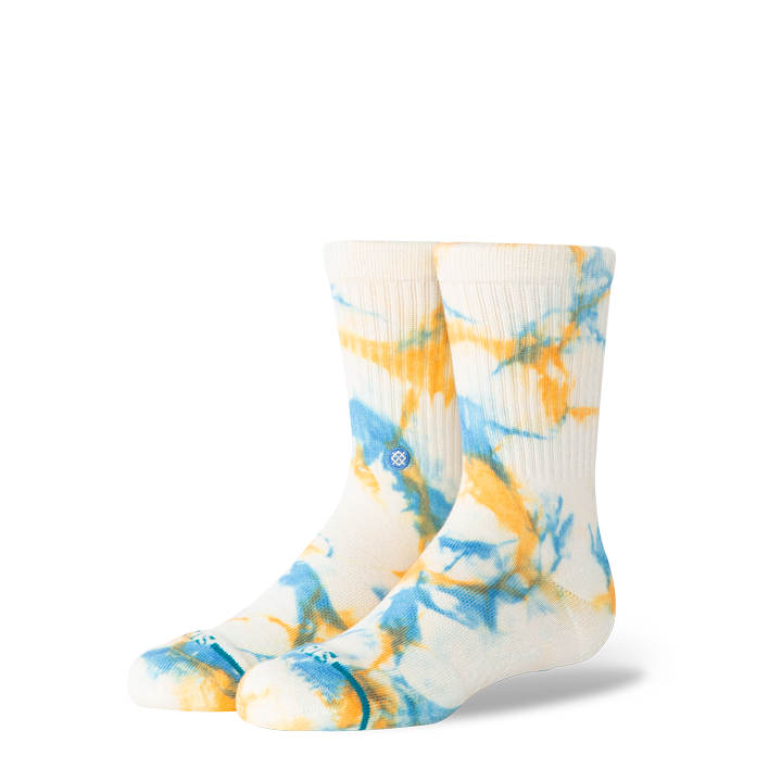 A pair of crew socks with a white base featuring a blue and yellow tie-dye pattern, displayed against a solid white background.
