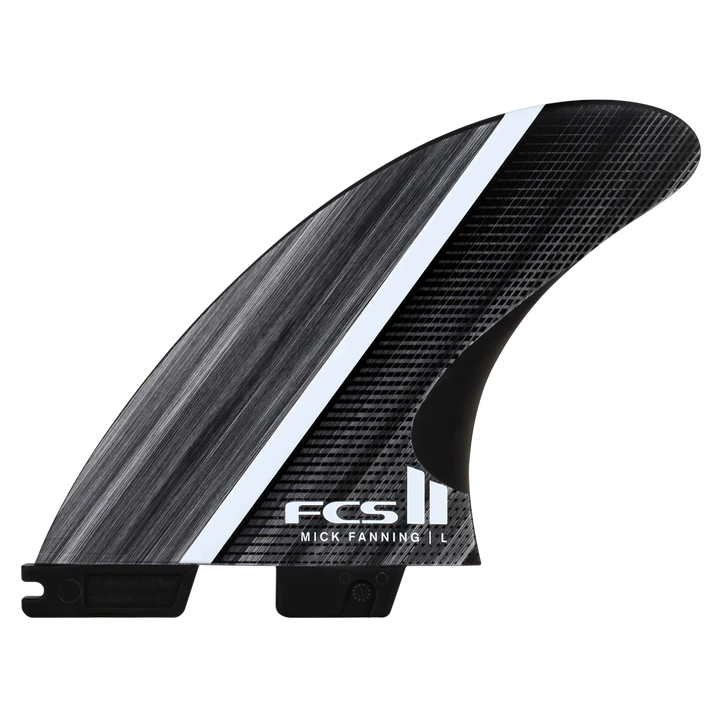 Carbon fiber surfboard fin with FCS logo on a white background