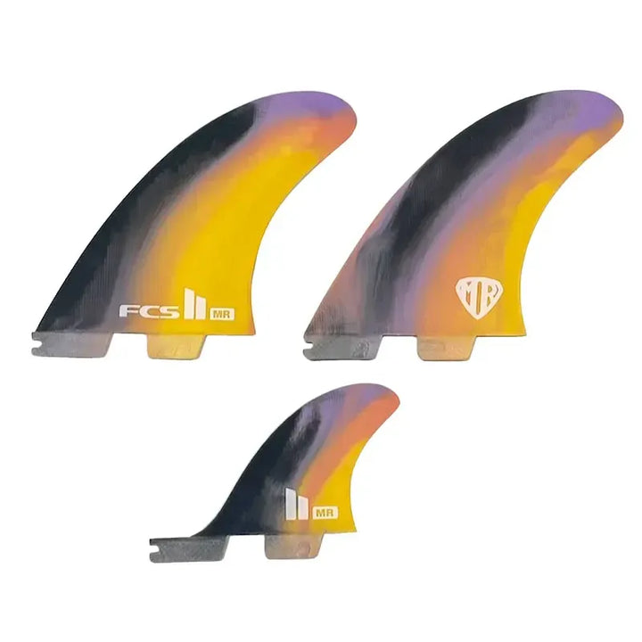 Three surfboard fins with a colourful gradient design on a white background