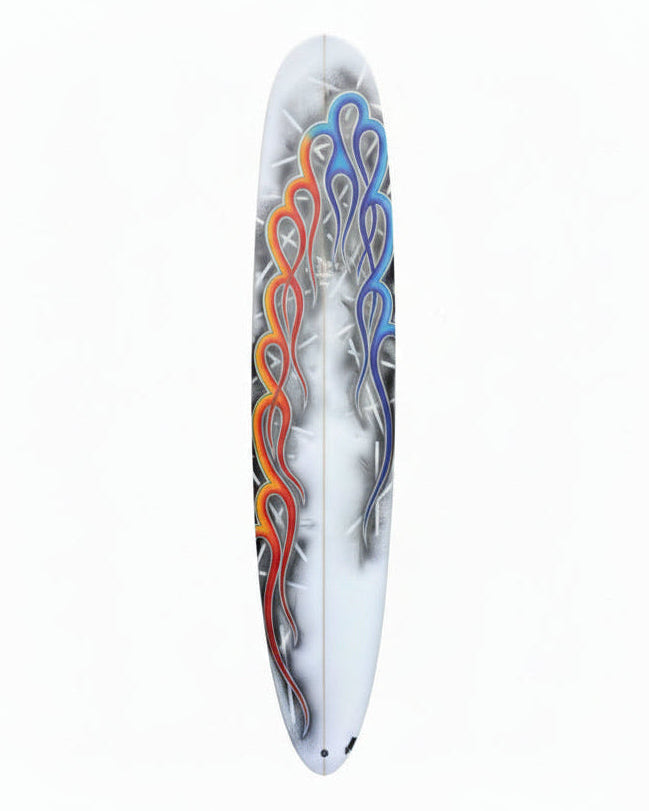 Decorative surfboard with colourful flame design on a white background.