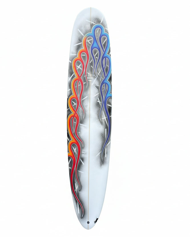 Decorative surfboard with colourful flame design on a white background.