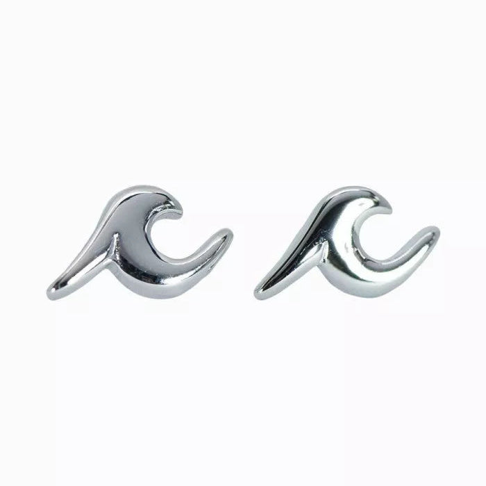 Silver wave-shaped earrings on a white background