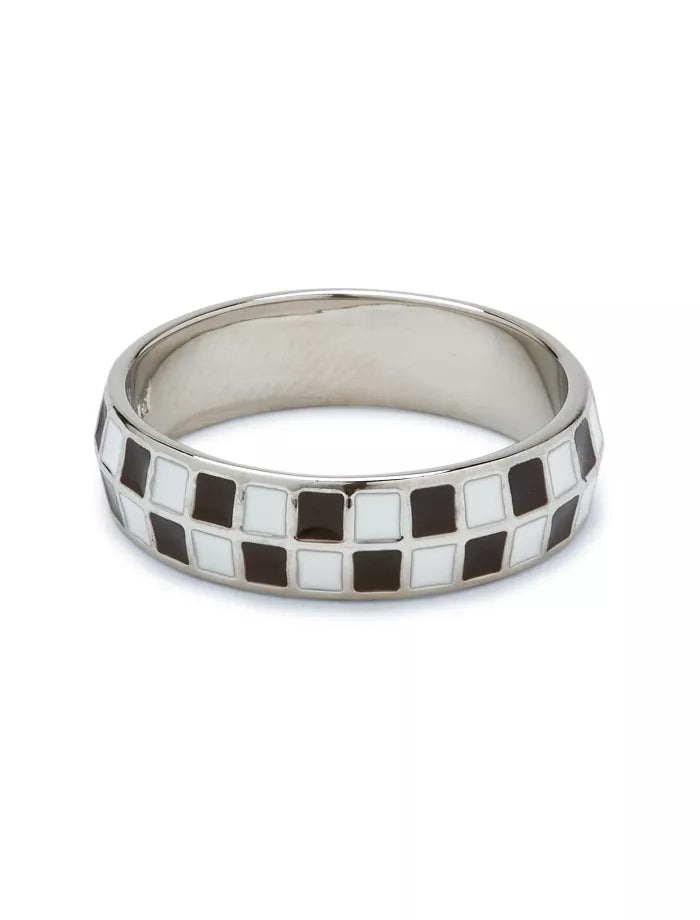 Silver ring with black and white checkered pattern on a white background