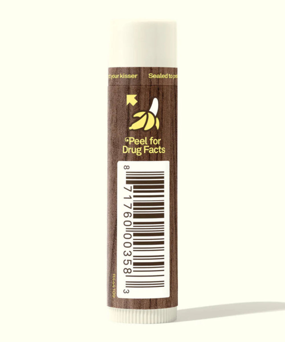 Lip balm with a brown tube and white cap on a white background