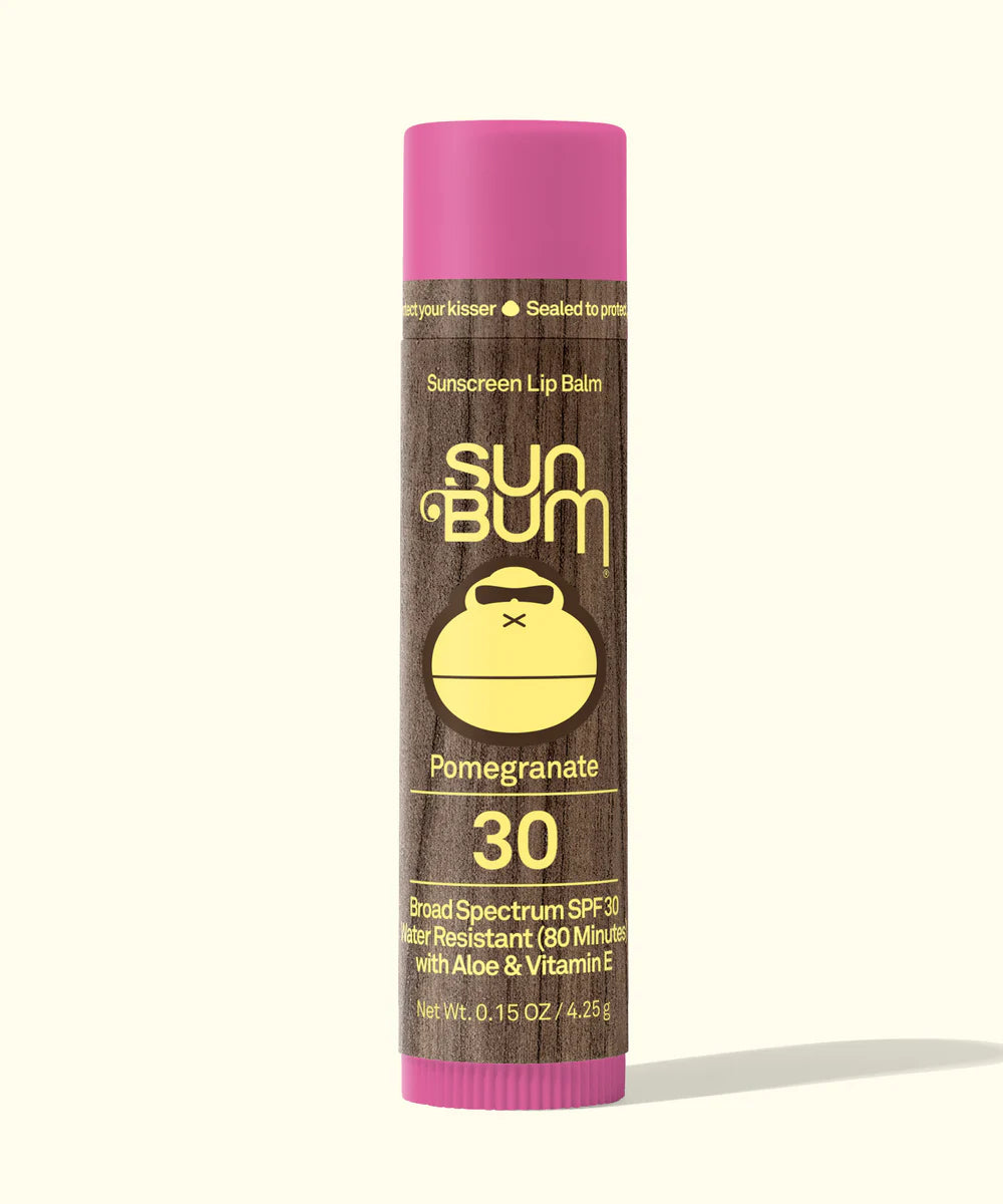 Sun Bum lip balm with pink cap and brown label on a white background