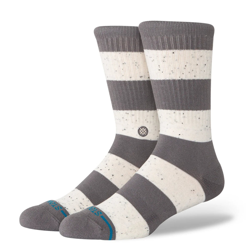 Pair of gray and white striped socks with a visible brand logo on a white background