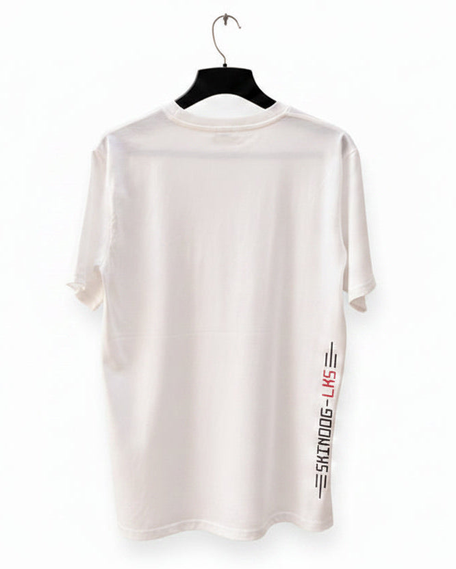 A white short-sleeve t-shirt hanging on a black hanger against a white background. The back of the shirt features a vertical graphic print on the lower right side with the text 'SKINDOG-LKS' in black and red.