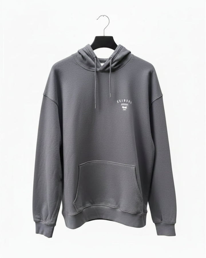 Dark grey hoodie with a Skindog Surfboards brand chest logo on a white background