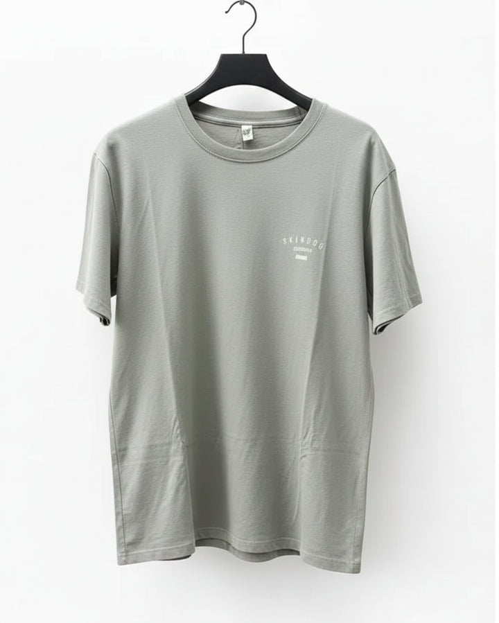 Green t-shirt on a hanger against a white background