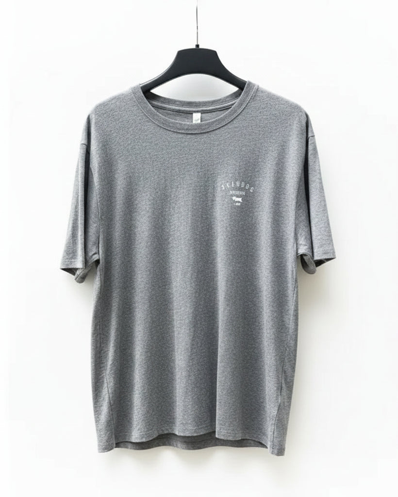 Grey t-shirt on a hanger against a white background