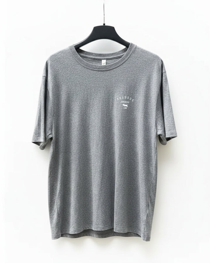 Grey t-shirt on a hanger against a white background