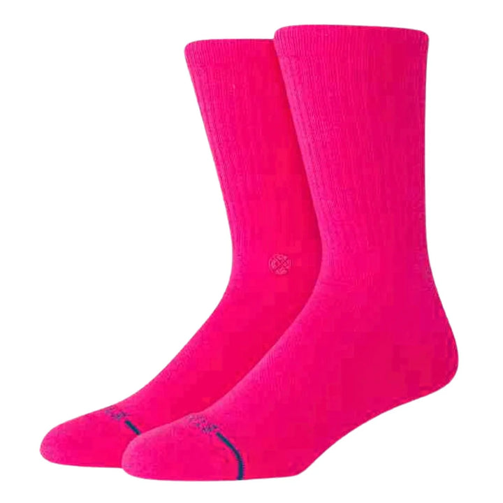 Two bright pink socks on a white background