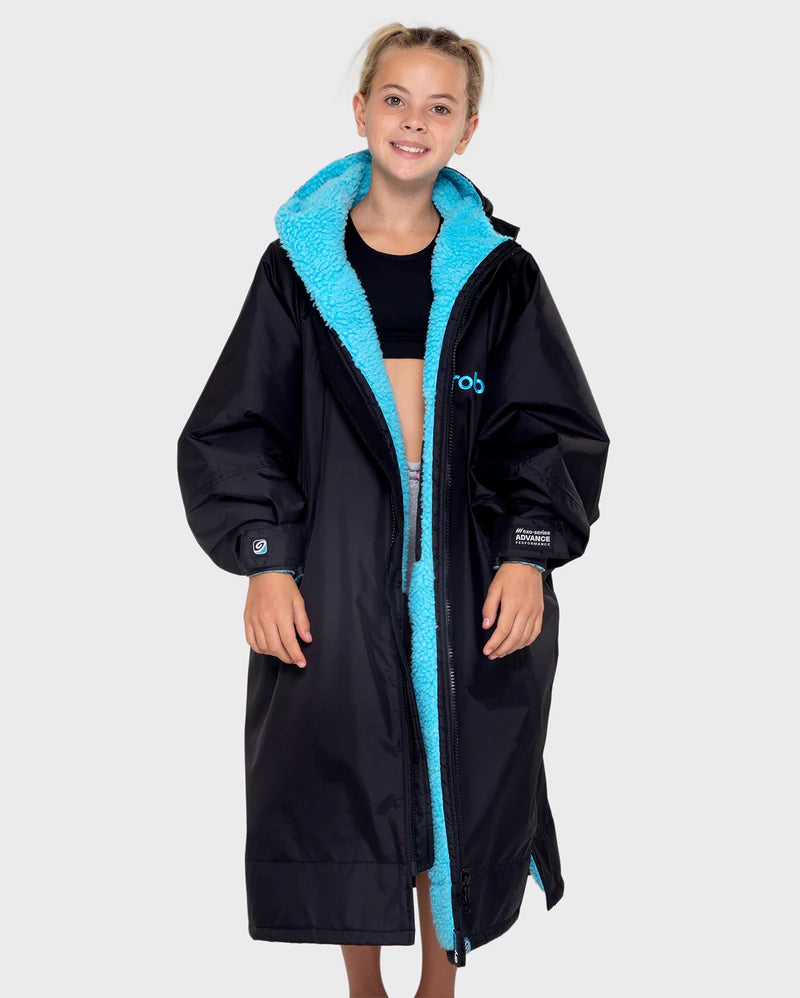 Person wearing a black coat with blue lining on a white background